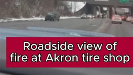 Roadside view of fire at Akron tire shop