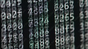 Code and numbers scrolling on computer monitor. Hacking activity analyzing source code. Hex header file numbers analysis for hacking purpose and decryption during Cyber War and cyber crime actions