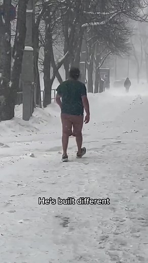 Man Wearing Shorts in Snow - Braving the Winter Weather