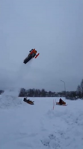 Insane Snowmobile Road Gap Jump!