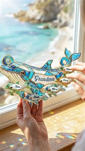 A dolphin stained glass suncatcher for grandma that fills the room with sunlight and family love