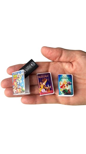 Grandma Gets Real®️ on Instagram: "**Miniature Disney VHS Tapes** Which movie was YOUR favorite? 🎬 Toy Story, Beauty and the Beast, or The Little Mermaid? My kids practically wore out our Little Mermaid VHS from rewinding it so many times! 📼✨ There’s something magical about these tiny classics. #DisneyVHS #VHSTapes #90sKids #DisneyClassics #MiniatureCollecting"