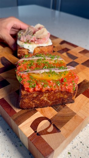 With Valentine’s Day approaching, I wanted to put together a three-course menu for you to bring the restaurant home this year. Part 1, the starter, is this beef fat toast, made two ways. The first is inspired by a classic pan con tomate with an ultra vibrant tomato relish. The second, topped with straciatella, honey, white truffle and prosciutto. This is a super simple but effective started that looks good, tastes fantastic and requires very little to pull off. It also leans nicely into parts 2 