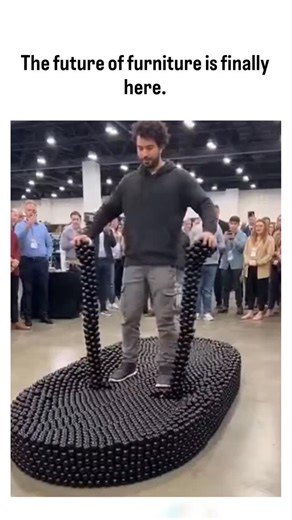 curvico_explained on Instagram: "The post showcases a 10-second video of a transforming modular chair assembled from interlocking black hexagonal plastic modules, demonstrated at a crowded trade show, emphasizing space-saving and customizable furniture innovation. Authored by Rwandan crop scientist Jacques Muhirwa, a curator of viral content, it exploded to 11.7 million views and 9,448 likes within hours, tapping into growing interest in sustainable, adaptable home designs amid urban space const