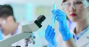 clip-1038534701-asian-scientist-team-use-test-tube-filling