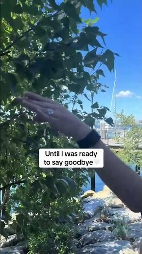 Crying Woman Comforted by a Tiny Bird at a Street Café