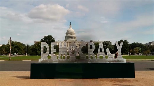 Artists install a 3,000-pound, 17-foot-wide ice sculpture spelling ‘DEMOCRACY’ on the National Mall in Washington, D.C., designed to gradually melt throughout the day and symbolize America’s ‘weakening democracy’ | Reuters