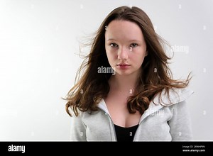 Wear Your Gorgeous Hair With Flare Mixed Race woman tossing hair cute girl tossing her hair and shaking her head slow motion video. beautiful hairstyle long flowing brown hair Stock Photo - Alamy