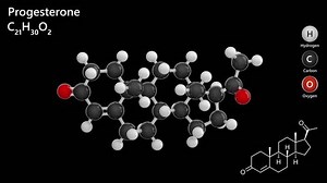 Progesterone. Female sex hormone. Animated 3D model of a molecule. Molecular formula: C21H30O2. Chemical model: Ball and stick. Black background. 3D rendering. Seamless loop.