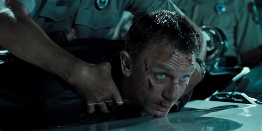 Daniel Craig’s version of James Bond redefines the iconic spy as a rugged, emotionally scarred, and intensely physical operative—grittier and more human than previous portrayals. Physically, Craig brings a muscular, compact build to the role: around 5’10” (178 cm) tall, broad-shouldered and powerfully athletic, with a fighter’s frame shaped by intense training and real stunts. His face is sharply handsome yet weathered—piercing ice-blue eyes that convey both cold calculation and buried pain, sho