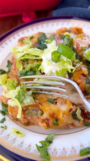 Nisha | Indian + Fusion Recipes on Instagram: "Soft & gooey Veg Mexican Lasagna. Layers of tortillas, beans, veggies, enchilada sauce, and cheese. Perfect for the holidays. Comment “LASAGNA” and I’ll dm you the recipe. https://www.honeywhatscooking.com/mexican-lasagna/ Mexican Lasagna, Mexican fusion, baked vegetarian casserole, Christmas 2025, Christmas recipes"