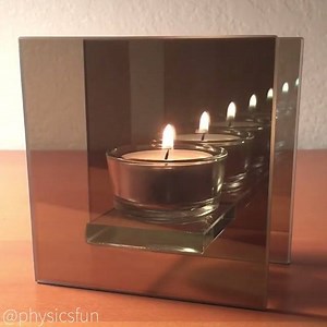 These parallel partially mirrored panes of glass create the illusion of multiple candle flames. 😎 via Physicsfun | UNILAD Tech