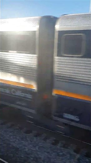 Passing Amtrak California on Caltrain.