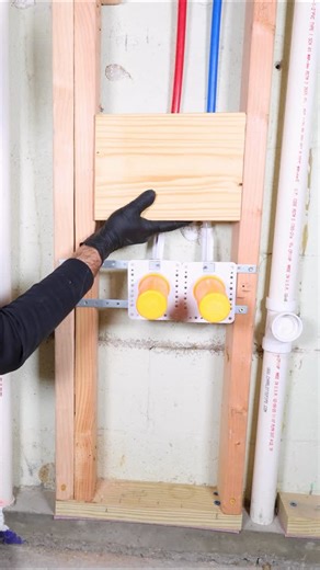 Home Repair Tutor on Instagram: "Bathroom sink cabinet tips…I’m installing an 18 inch vanity cabinet but want solid blocking for it. I pre-drill the four corners of the 2x8 and use 3 inch GRK Multi-Purpose screws. This provides solid blocking to fasten the cabinet to after drywall installation 🔥#bathroomremodel #homerenovation #homerepairtutor"