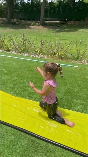 Brother tries to teach sister how to slip and slide then this happens #shorts
