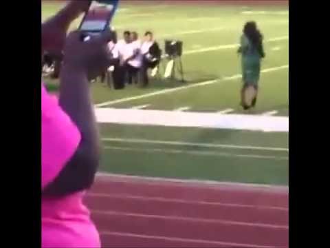 GRADUATION FAIL : Young Lady Falls While Wearing Heels on Grass [VIDEO]