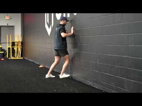 Standing Wall Dorsiflexion on Wedge | Ankle Rehab