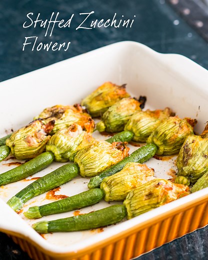 Stuffed zuccchini flowers with ricotta, bacon and mushroom are party-perfect appetizers. When zucchini blossoms are plentiful this season, you have to try these! RECIPE--> https://whiteonricecouple.com/stuffed-zucchini-flowers/ | White On Rice Couple