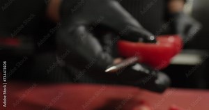 Male hands string green tomatoes on a skewer. Chef prepares vegetables in a restaurant. Arabic and oriental food