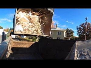 Front load garbage truck dumping then hopper view of remaining rural route