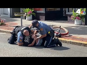 NJ Police Officers Caught ON Camera Taking Down Teen Cyclist | NBC New York