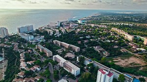 Modern build residence building with pool by the beach on rocky caves in Majorca. Carrer de Cala Antena, Cales de Mallorca, Balearic Islands, Spain.