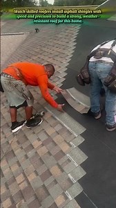 Professional Roofers Installing Asphalt Shingles On New Roof