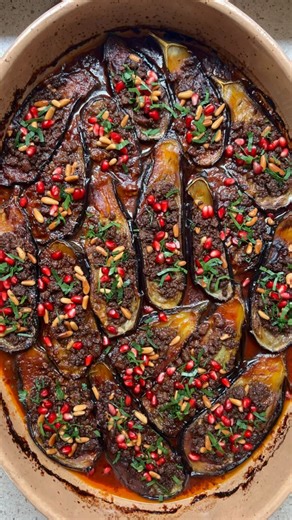 Sunday Kitchen on Instagram: "SHEIKH EL MAHSHI Eggplant stuffed with lamb mince in tomato sauce Ingredients 1 kg eggplants (preferably small) neutral oil for frying 500grams coarse lamb mince Handful of Lebanese pine nuts Ghee Salt to taste 2 tsp 7 spice bharat 250mls tomato passata 1 tbs tomato paste 1 tbs pomegranate molasses To garnish Pomegranate seeds Finely chopped parsley Cut the eggplants lengthways and salt generously, place in a colander to strain whilst you work on the mince filling a