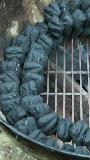 Building a charcoal snake for low and slow smoking on a Weber kettle grill