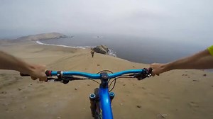 Bikers Ride Down Sandy Ridge