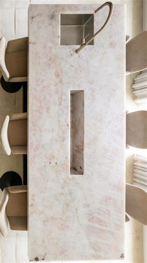 If soft pink speaks to your style, save this for your next design project. This delicate hue is redefining modern interiors — soft, elegant, and effortlessly popular. While neutrals will always have their place, we’re seeing a shift toward gentle color that adds depth and sophistication. Would you bring this serene tone into your home? . . . soft pink stone | blush marble | quartz design | luxury countertops | interior surfaces | modern kitchen design | statement slab | natural stone inspiration