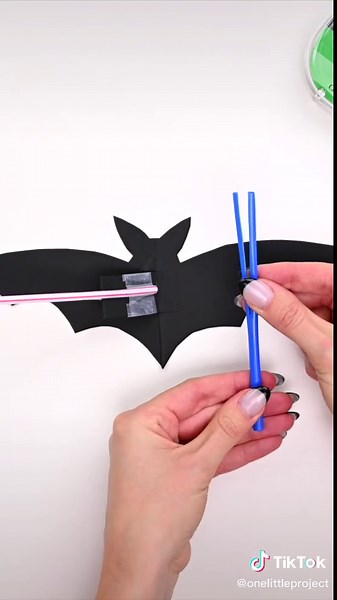 This flapping bat is SO COOL and it’s really easy to make! 🦇 The best part is the wings flap just like a real bat! Grab the free printable template from our website and make this cool Halloween craft! #batcraft #bats #halloweencraft #halloweencraftsforkids #halloweenactivities #halloweenideas #fallcrafts #fallcraft #kidsdiyideas #kidsdiy #craftymoms #craftymom #onelittleproject #stemactivities
