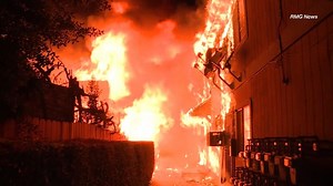 Residents flee as fire engulfs building