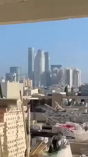 Moment of Impact: Massive Explosion Between High-Rise Buildings in Central Israel Footage captures the exact moment an Iranian missile slams into a densely built urban area, exploding in the center between multiple high-rise residential buildings. The blast sends shockwaves through the district, causing widespread damage and panic. | Manipur 24/7 Live News