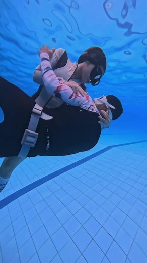 Freediving Couple In a Pool: Underwater Adventure