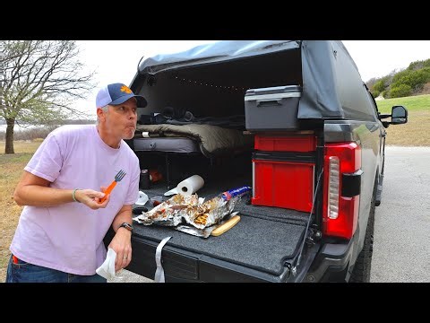 Solo truck camping in a new inflatable truck shell. Campfire ribs and cheesy potatoes