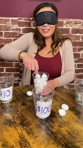 Ridiculous cotton ball in cup game Olivia and her friends play a game where you have to get a cotton ball into a cup blindfolded using a plastic spoon. They win money. This original video was produced by Network Media LLC and Olivia | Olivia