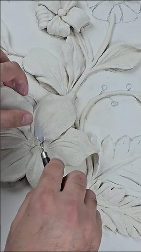 Making a bas-relief from clay