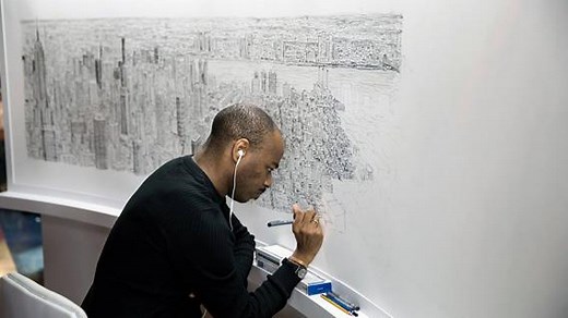 Join the artist Stephen Wiltshire at the Empire State Building as he draws the New York skyline after spending less than an hour observing it by helicopter. | Video From The New York Times