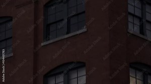 Tight tilting down shot of the Texas School Book Depository at Dealey Plaza, Dallas, Texas.