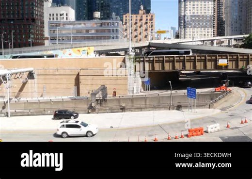 Traffic in Manhattan Midtown, Hells Kitchen New York City, United States of America. Lincoln Tunnel highway junction near Port Authority bus terminal. Toll road transport, cars in residential district Stock Video Footage - Alamy