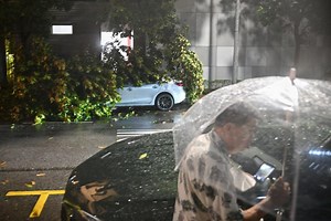 Strong winds, heavy rain batter Singapore, uprooting trees and slowing traffic
