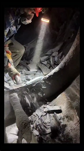 Real Engineerings | Engineering & Technology & Gadgets & DIY on Instagram: "Concrete Surgery: Manual Mixer Cleaning! 👷‍♂️⛏️ ​Step inside one of the most physically demanding maintenance jobs in the industry! This footage shows the claustrophobic reality of removing hardened concrete buildup from inside a massive industrial mixer drum. ​The Battle Against Buildup ​This process is essential maintenance because "dead concrete" reduces the mixer's capacity and adds useless weight: ​The Setup: The w
