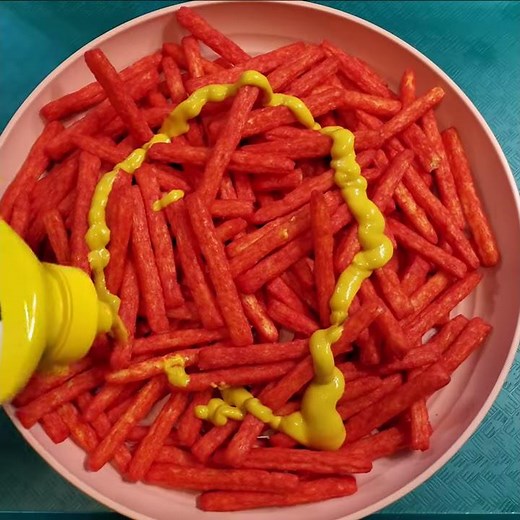 eat Chester's Flamin Hot Fries with Yellow Mustard