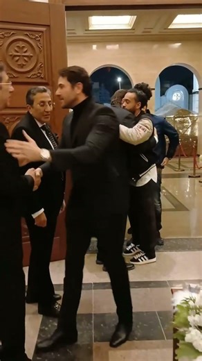 Actor Ahmed Ezz offers his condolences to actor Hani Ramzi at his mother's funeral.