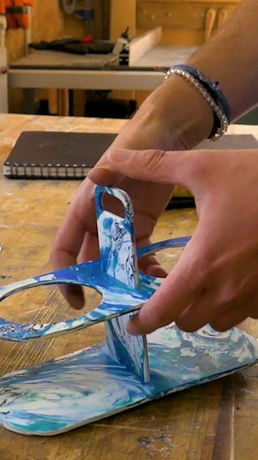 We designed and made this flat-pack coffee cup holder with a carry handle for those coffee lovers who always seem to be carrying a million things at once. This was made with 550g of collected recycled plastic waste HDPE from bottle lids and milk bottles. Once the plastic was all nice and melted and pressed into a sheet, we chose the scroll saw to cut this out. This is because it has a super thin blade so the waste produced is a lot less. We also collected all of the waste that came off all the t