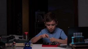 little boy studying science at home, how electricity works, science experiment