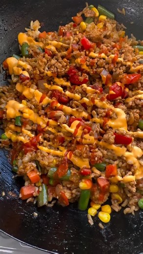 Sticky Spicy Sweet Chicken Fried Rice Sauce is : 1. 1/4 cup dark soy sauce 2. 1/2 soy sauce 3. 1 tablespoon sesame oil 4. 2 tablespoons sweet chili sauce 5. 1 teaspoon chili flakes 6. 1 tablespoon chili sauce ( sambal or sriracha) 7. 1 teaspoon sesame seeds 8. 1 tablespoon tomato paste 1. 8 oz ground chicken 2. 2 cup day old rice ( I used jasmine rice ) 3. 1 cup frozen mixed vegetables 4. 3-4 tablespoons olive oil divided to cook chicken and rice separately 5. 5-6 garlic minced 6. 1 tablespoon g