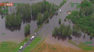Despite numerous warnings, emergency services are continuing to respond to trapped drivers who have attempted to drive through floodwaters. Earlier today, an #RFS helicopter captured footage of NSW Police Force and NSW SES crews rescuing a driver stuck in floodwater south of Lismore. Remember if it's flooded, forget it! If you require assistance with flood or storm damage, contact the NSW SES on 132 500. In a life threatening emergency, call Triple Zero (000). | NSW Rural Fire Service