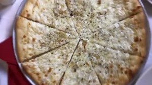 Our Pizza Blanca is topped with onions, olive oil, oregano, fresh garlic, and is vegetarian friendly. 🍕 | Little Italy Restaurant & Pizzeria